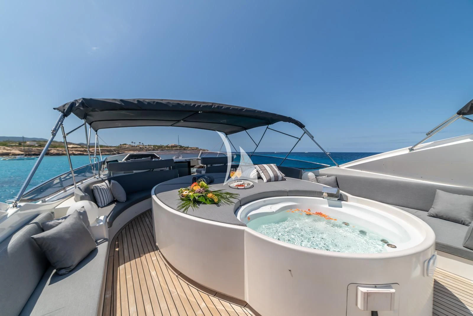 a boat with a table and chairs on the deck aboard IRMAO Yacht for Sale