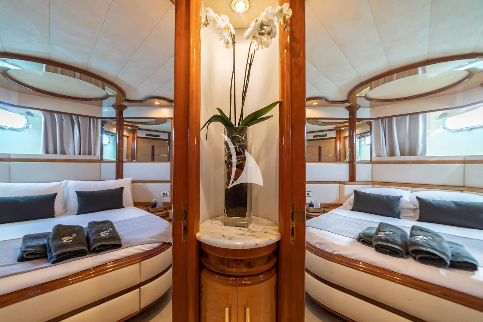 a room with a bed and a plant in it aboard IRMAO Yacht for Sale