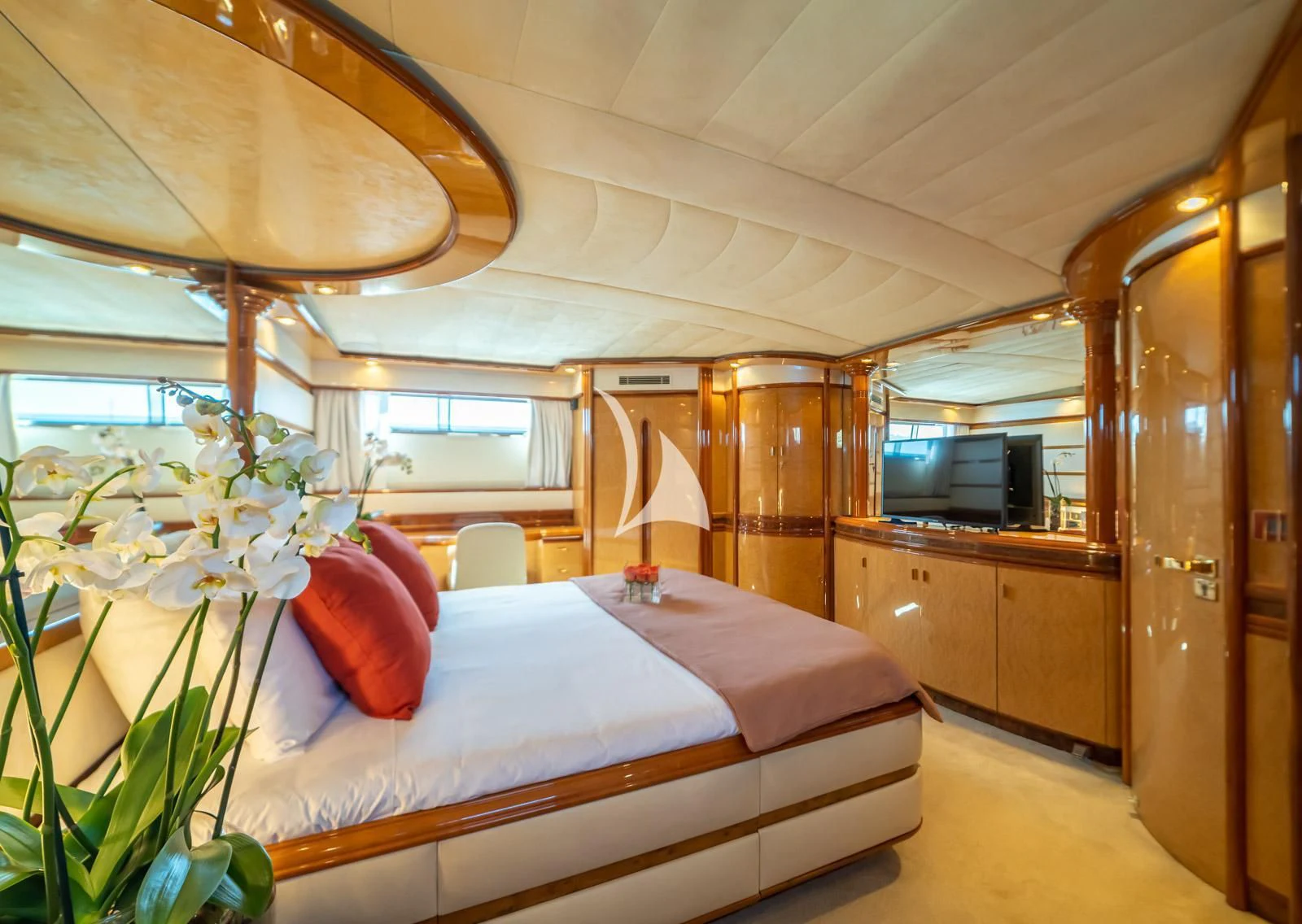 a bedroom with a bed and a desk aboard IRMAO Yacht for Sale