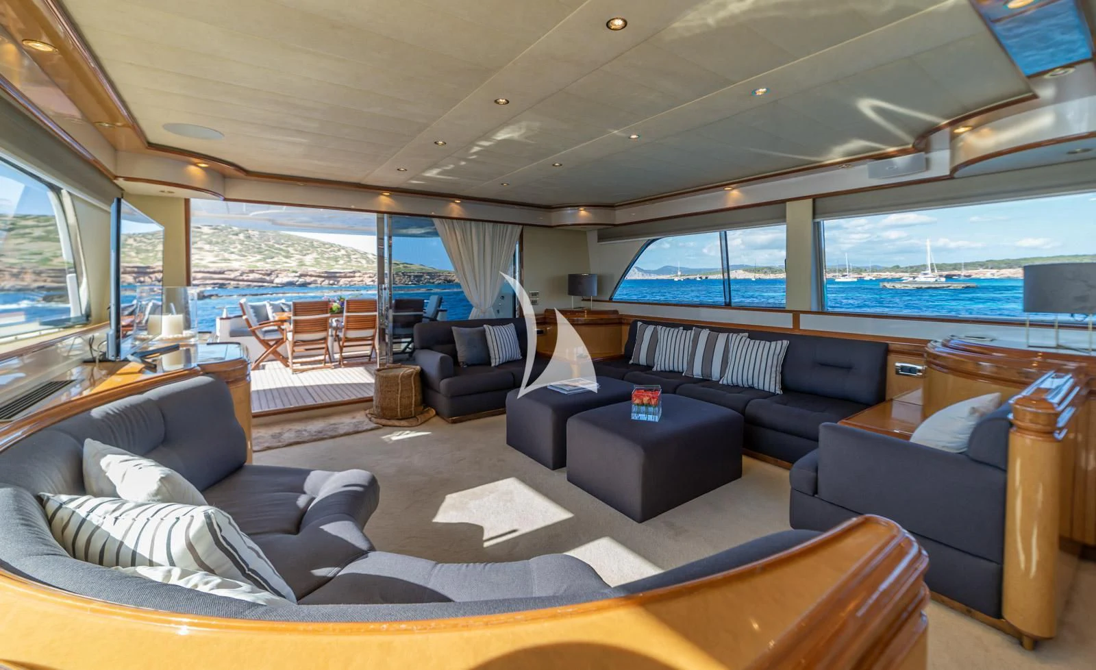 a living room with a large window aboard IRMAO Yacht for Sale