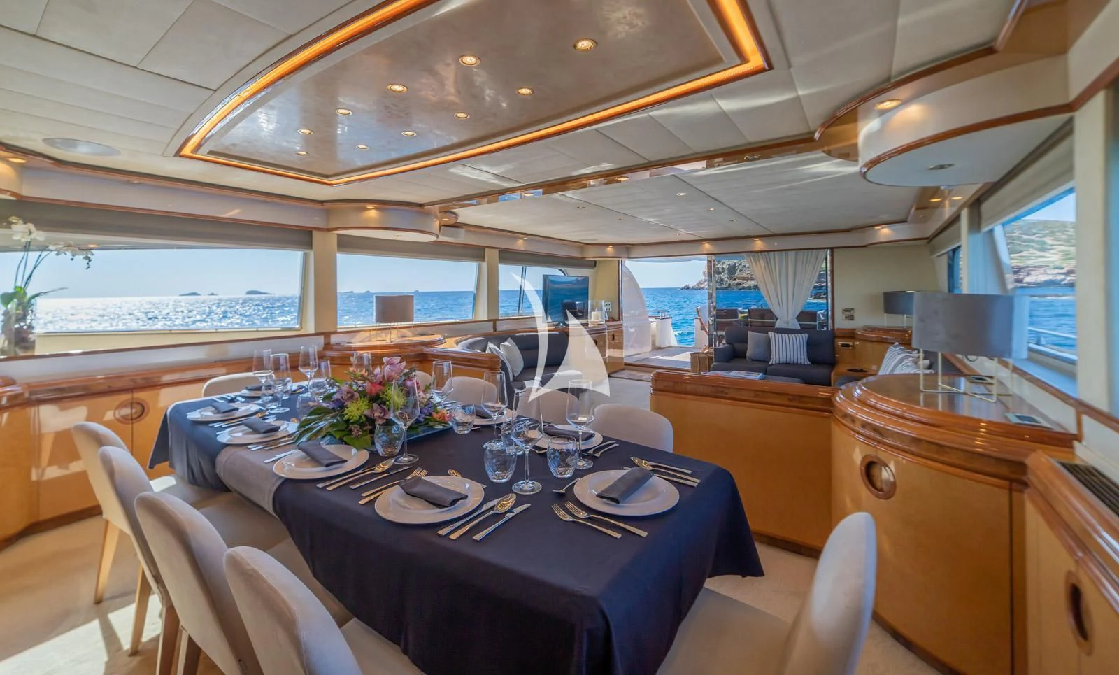 a dining room with a table aboard IRMAO Yacht for Sale