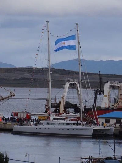 a large boat with a flag on it aboard SABRINA Yacht for Sale