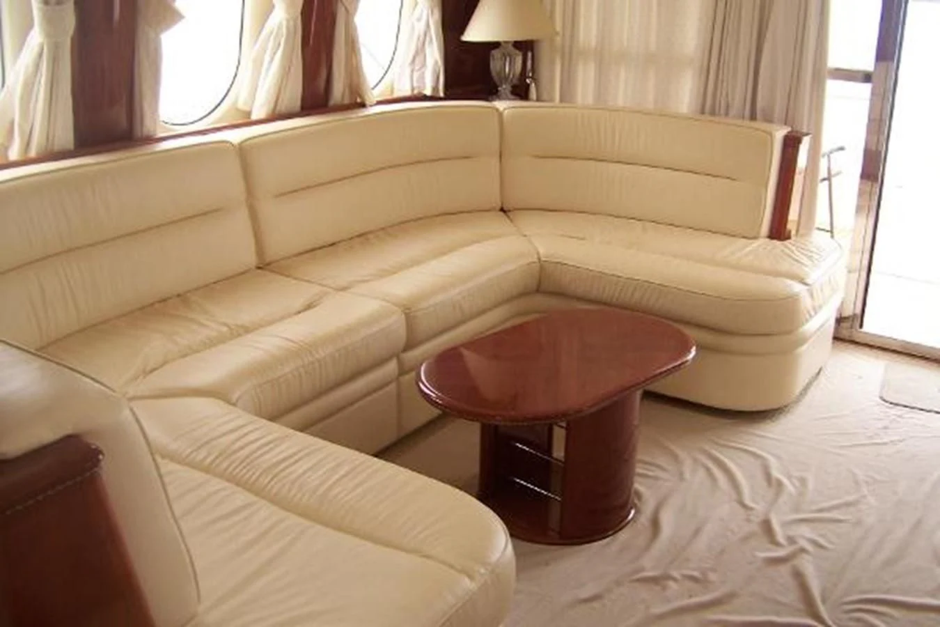 a couch with a coffee table aboard KAILANI Yacht for Sale