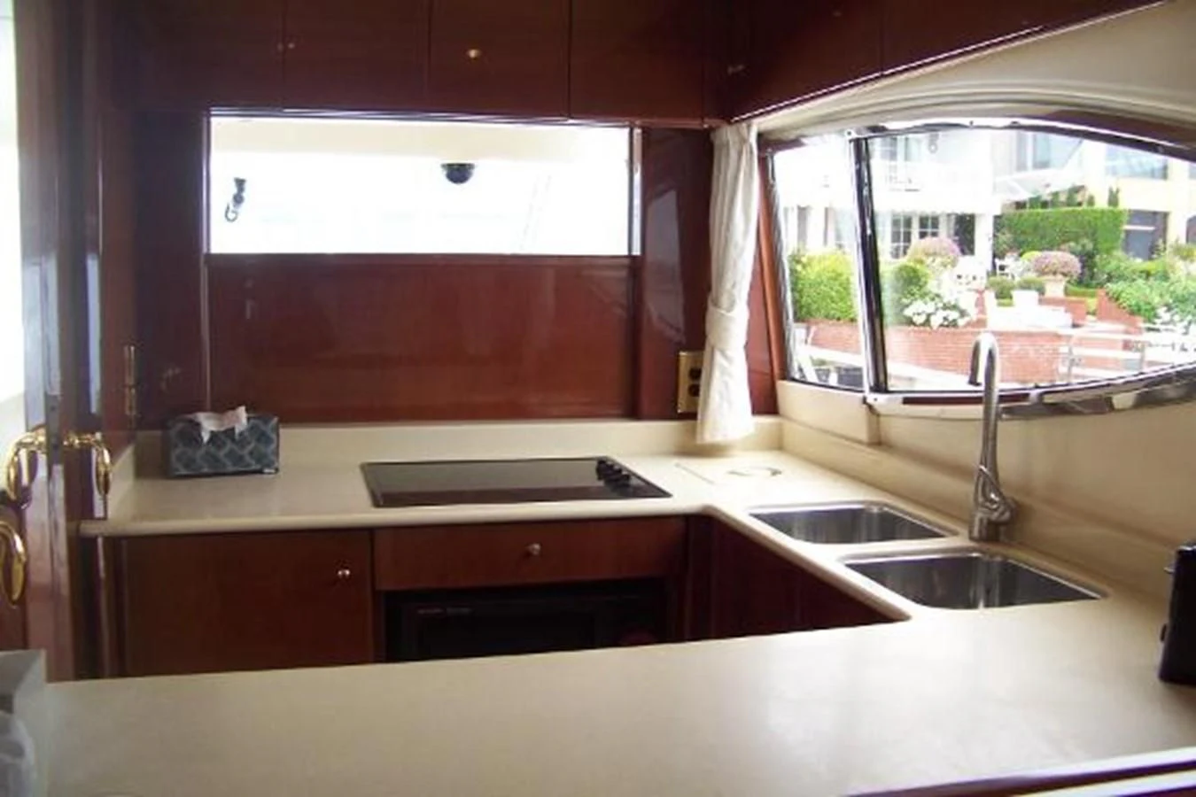 a kitchen with a sink and a window aboard KAILANI Yacht for Sale
