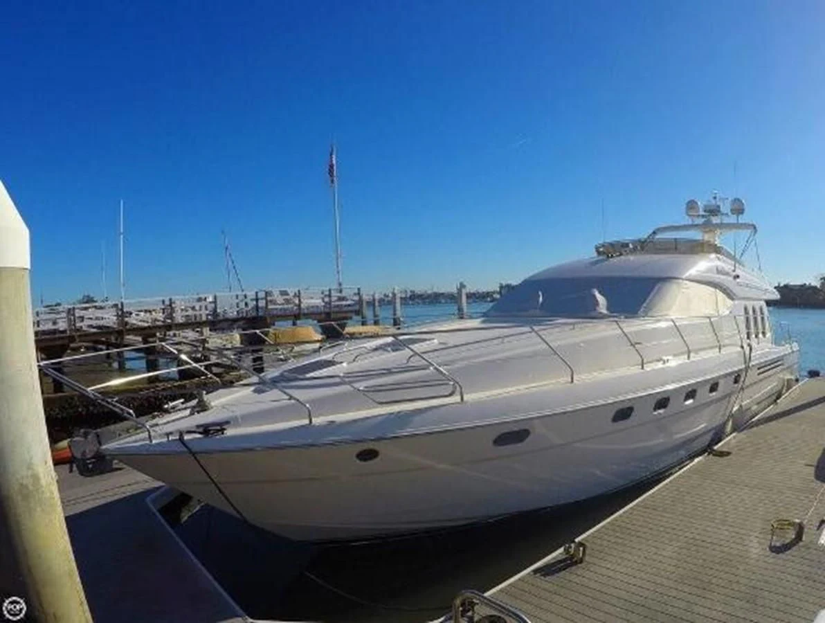 a large white yacht docked at a dock aboard KAILANI Yacht for Sale