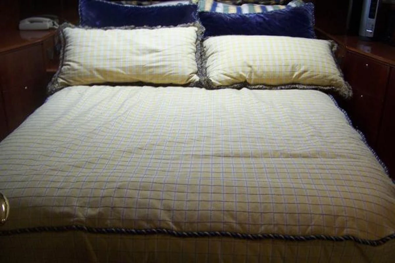 a bed with a pillow aboard KAILANI Yacht for Sale
