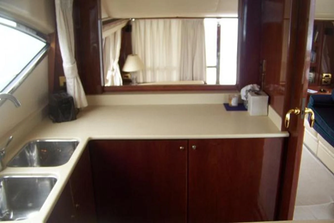 a bathroom with a sink and a window aboard KAILANI Yacht for Sale