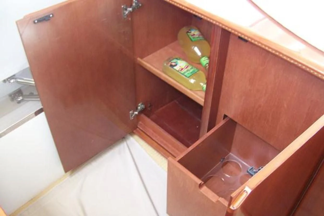 a bottle of alcohol on a shelf aboard KAILANI Yacht for Sale
