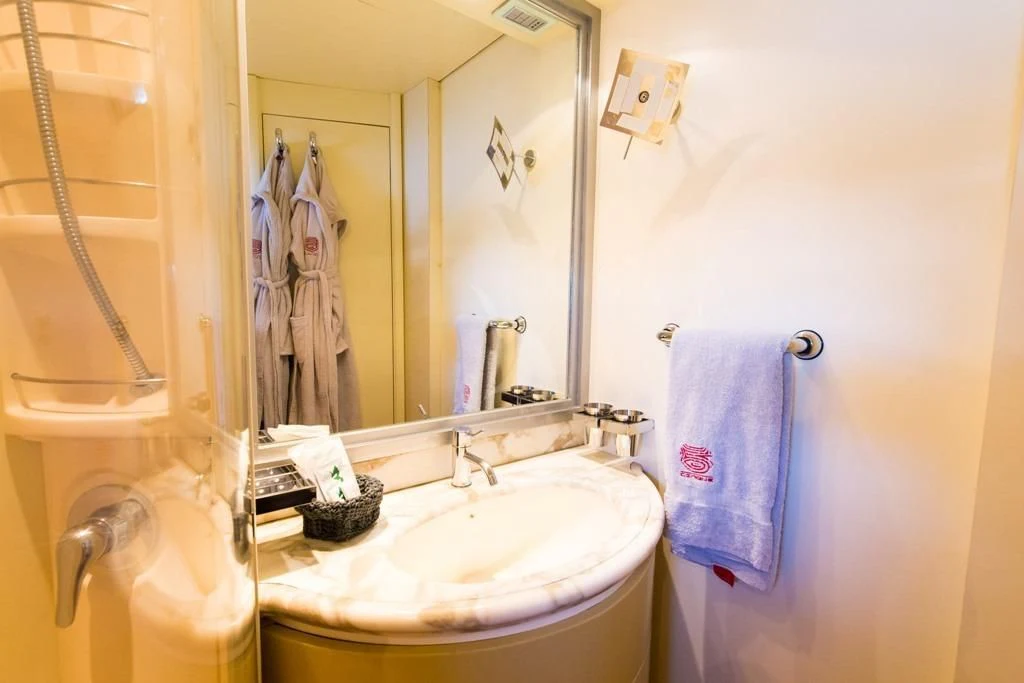 a bathroom with a sink and a mirror aboard CINQUE Yacht for Sale