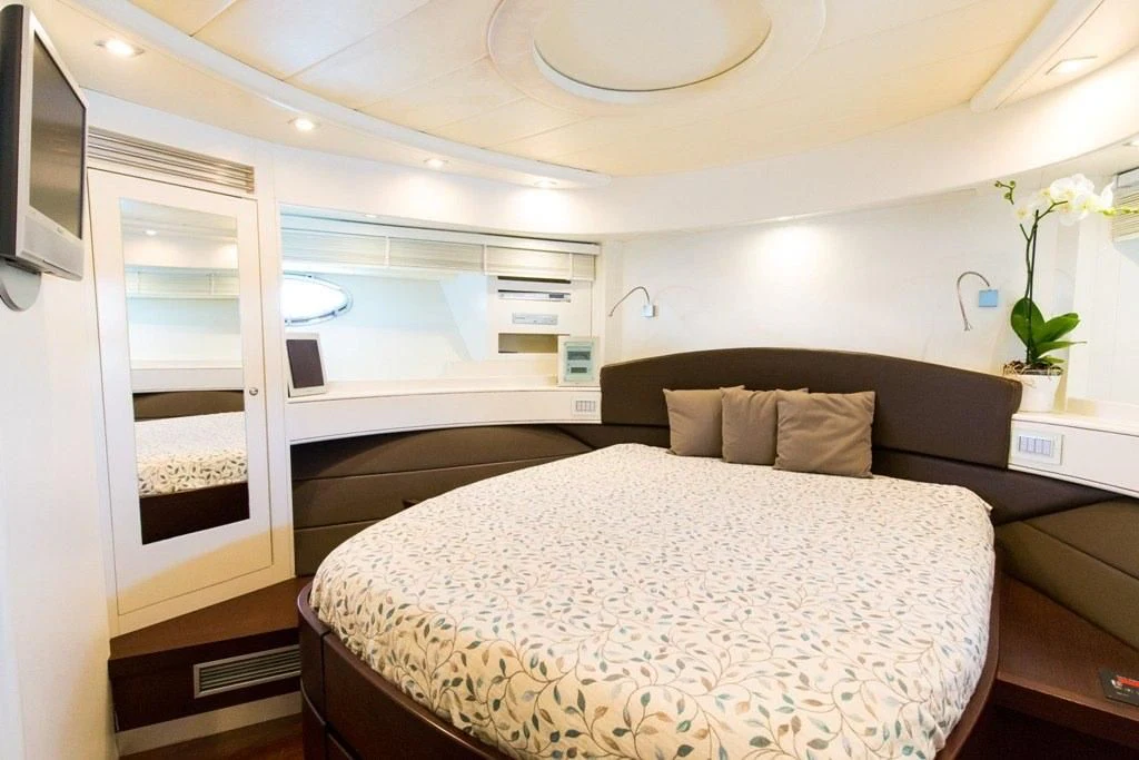 a bed in a room aboard CINQUE Yacht for Sale