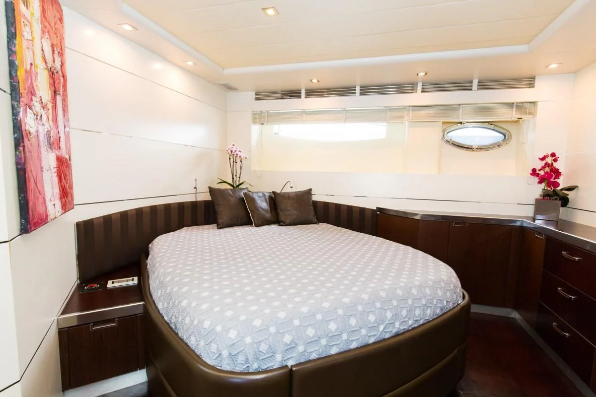 a bed in a room aboard CINQUE Yacht for Sale