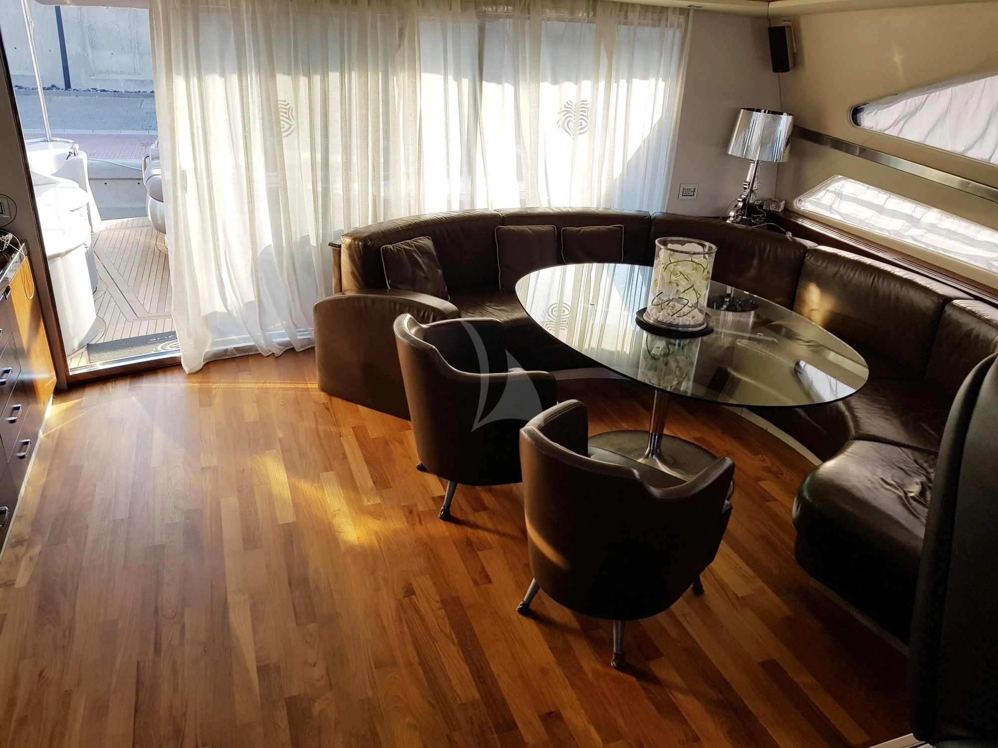 a living room with a couch and a coffee table aboard CINQUE Yacht for Sale
