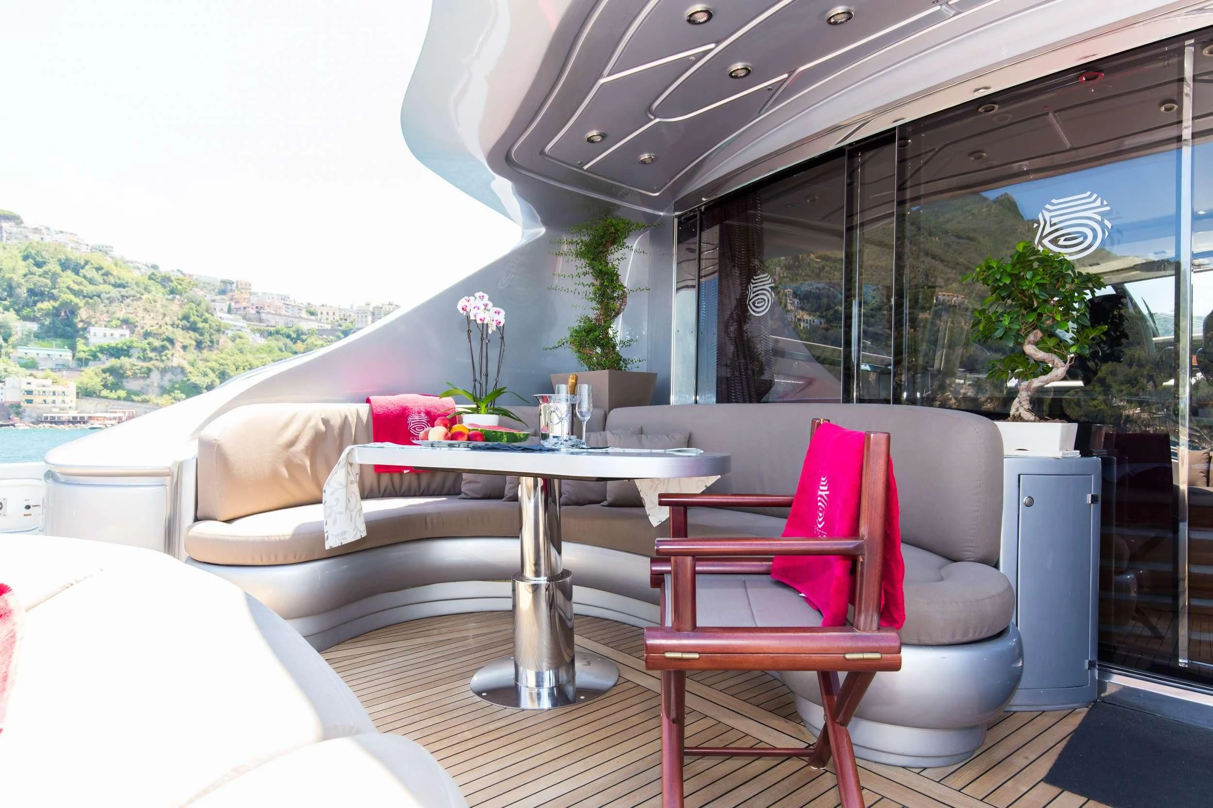 a room with a table and chairs aboard CINQUE Yacht for Sale