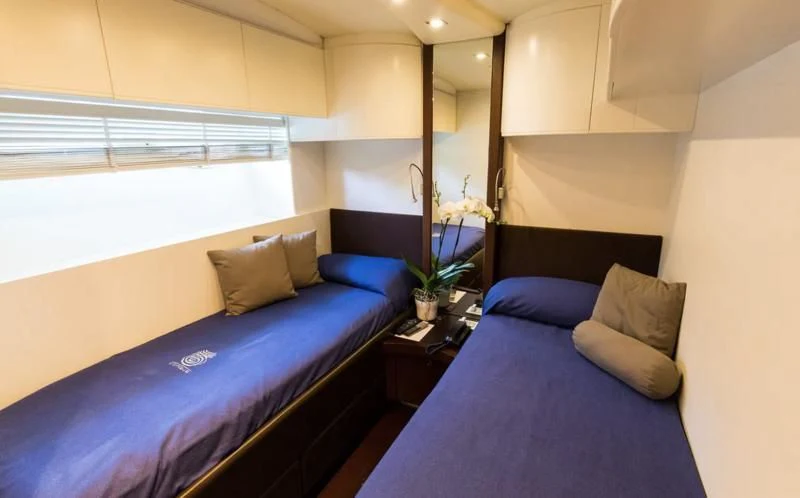 a bed in a room aboard CINQUE Yacht for Sale