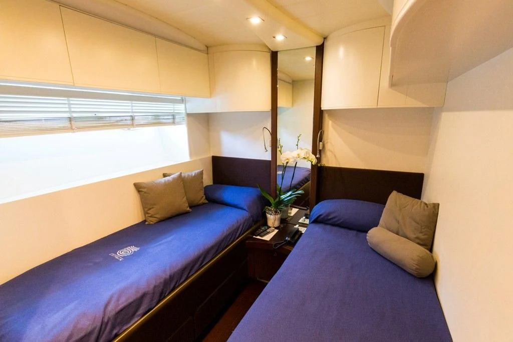 a bed in a room aboard CINQUE Yacht for Sale