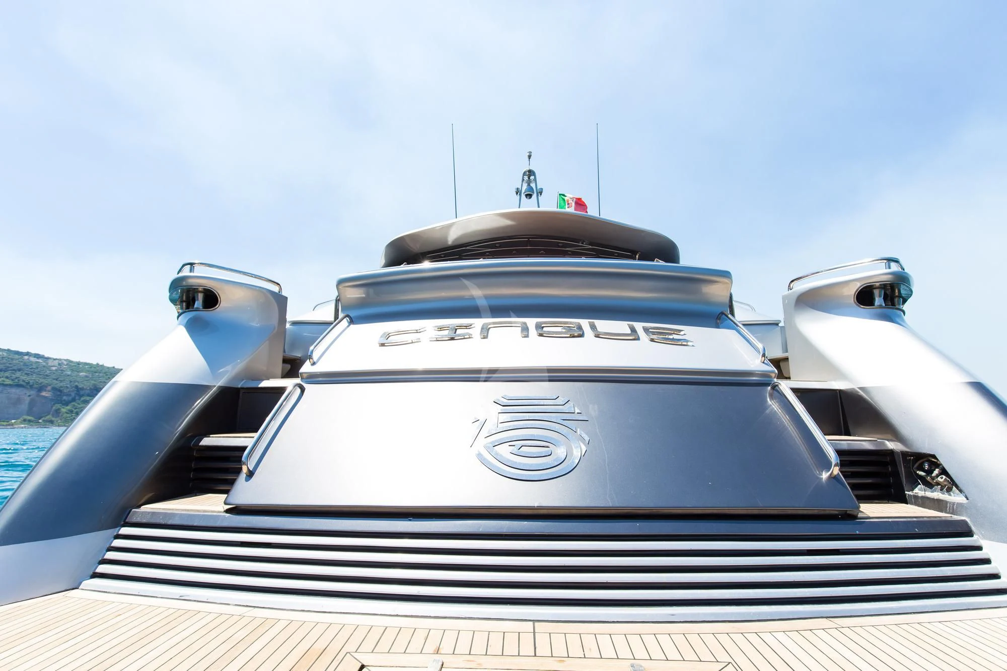 a white car on a balcony aboard CINQUE Yacht for Sale