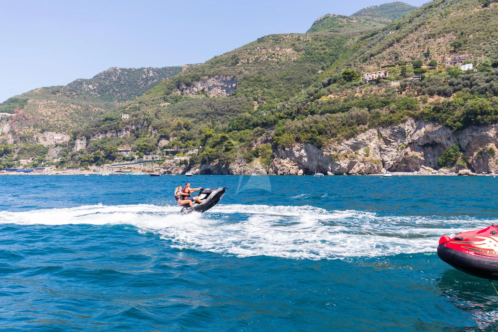 a person on a jet ski aboard CINQUE Yacht for Sale