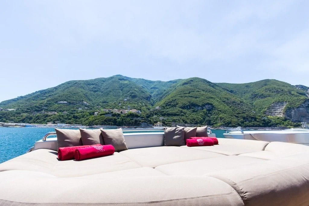 a bed with pillows on it aboard CINQUE Yacht for Sale