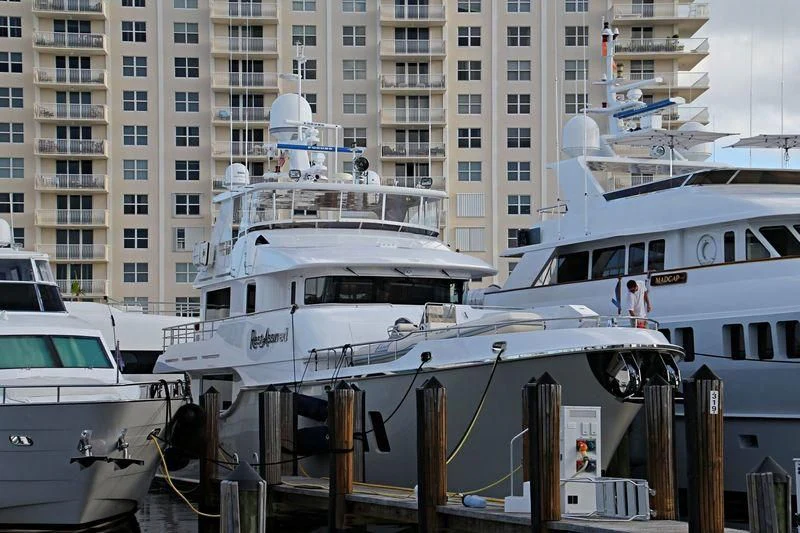 a group of boats are parked in a harbor aboard WARBIRD Yacht for Sale