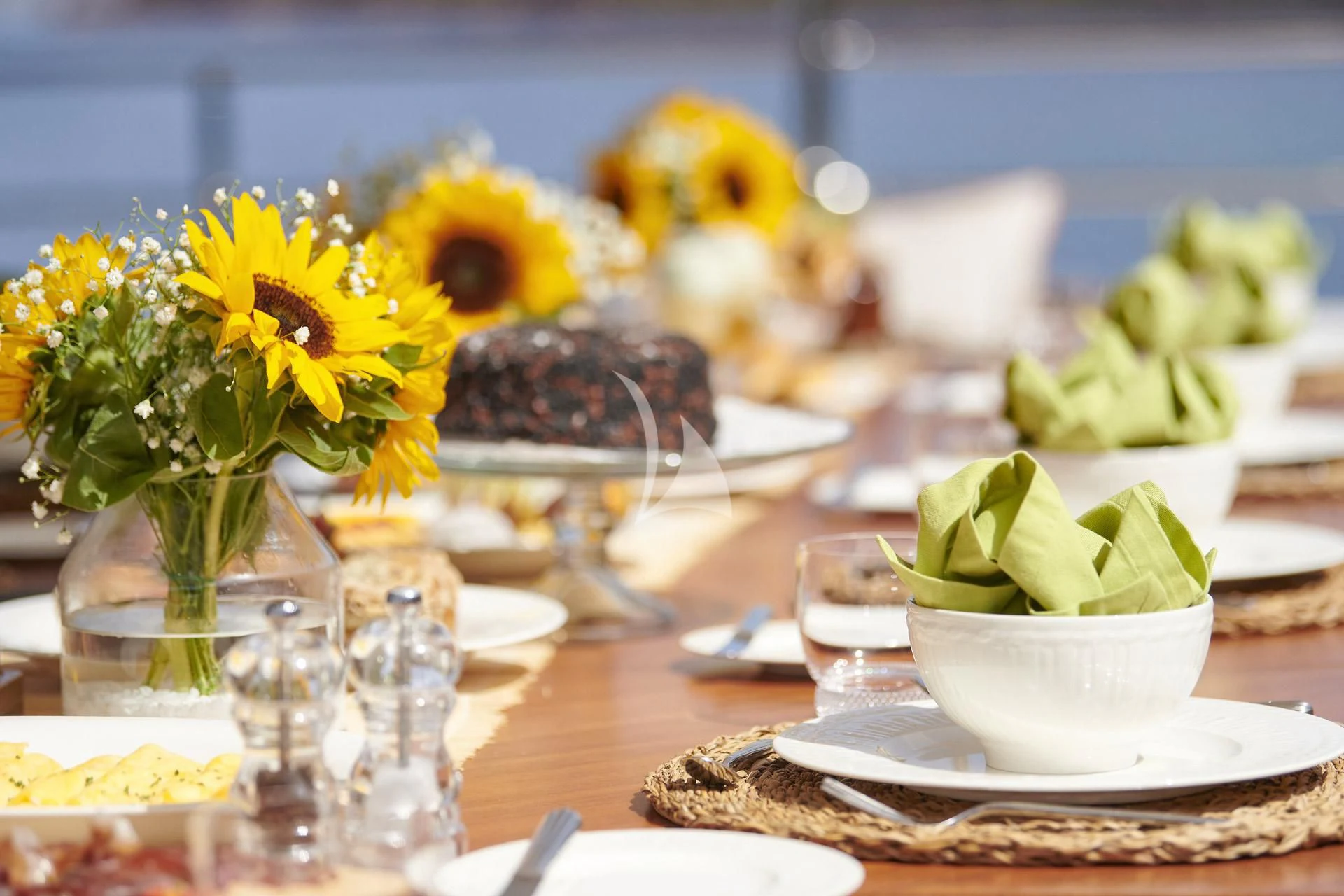 a table with plates and glasses aboard ELENA V Yacht for Sale