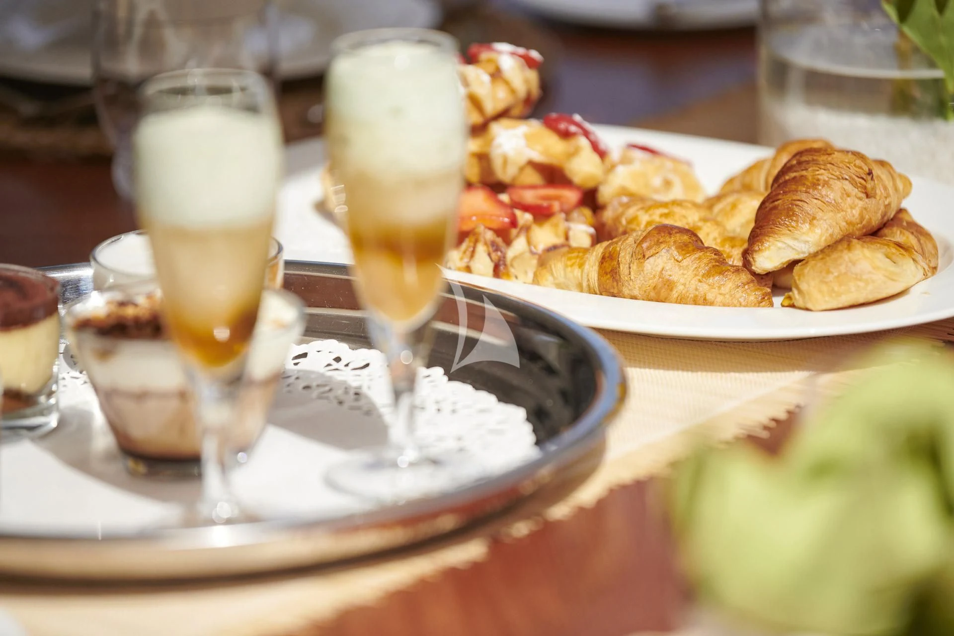 a plate of food and a glass of wine aboard ELENA V Yacht for Sale