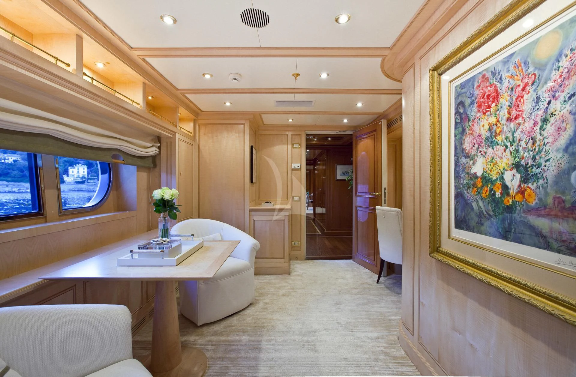 a room with a table and chairs aboard ELENA V Yacht for Sale