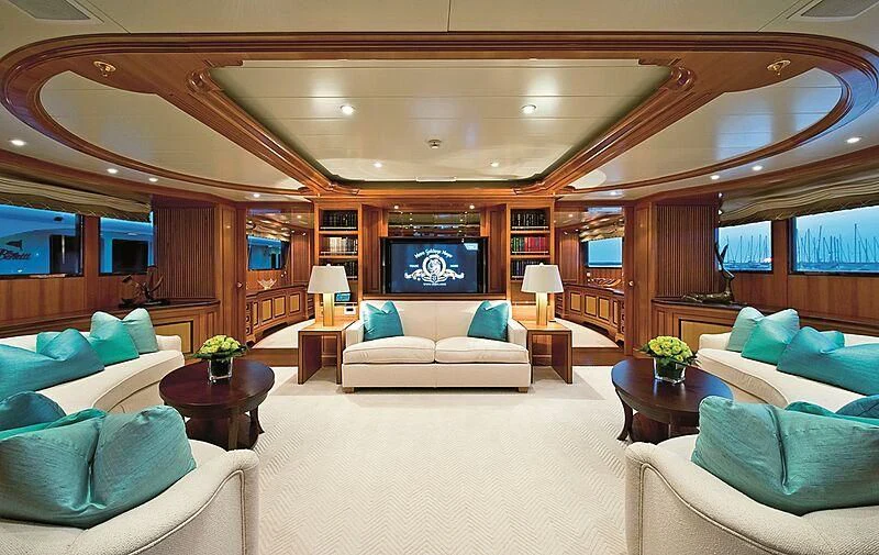 a living room with a large screen aboard ELENA V Yacht for Sale