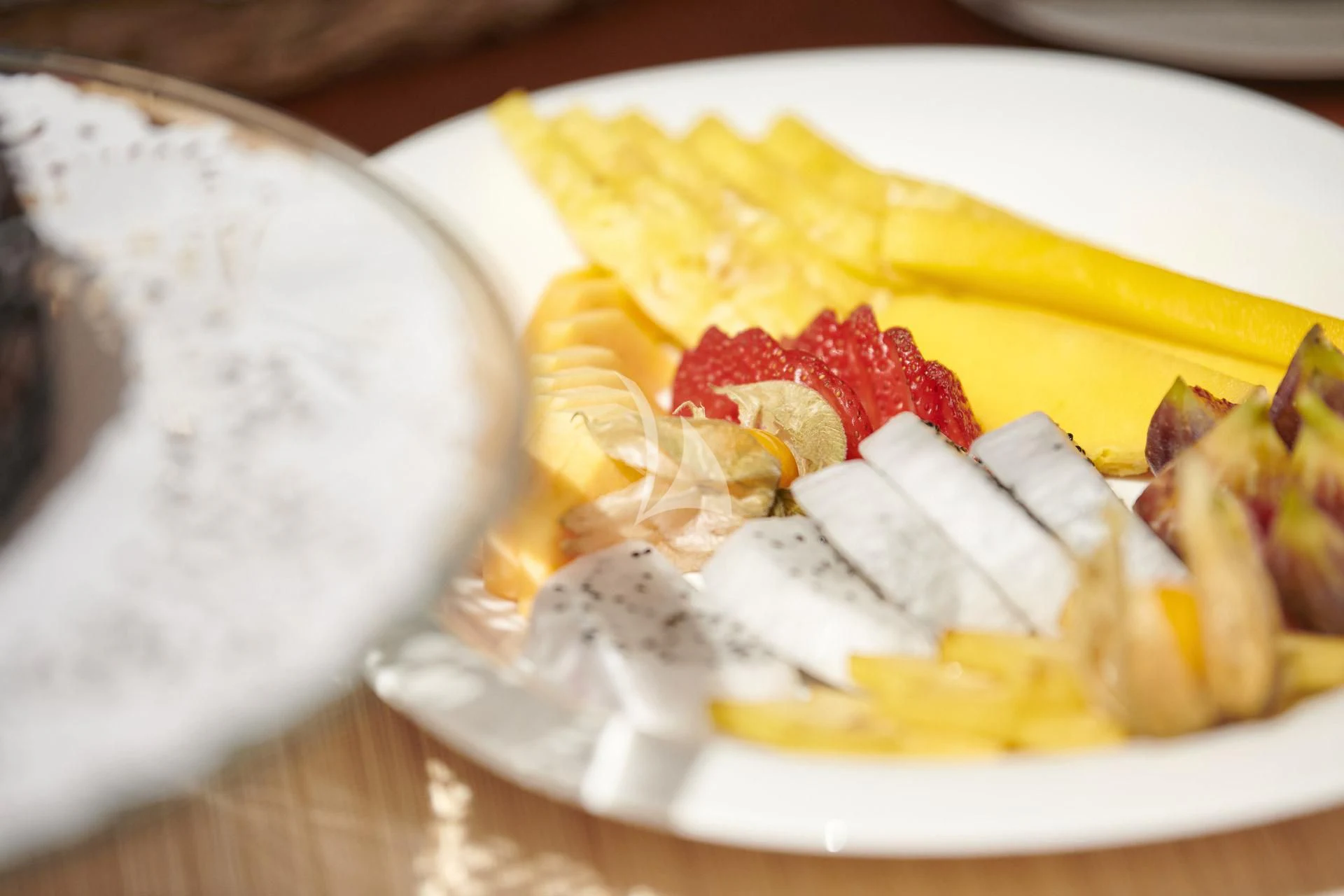 a plate of waffles with bananas and whipped cream aboard ELENA V Yacht for Sale