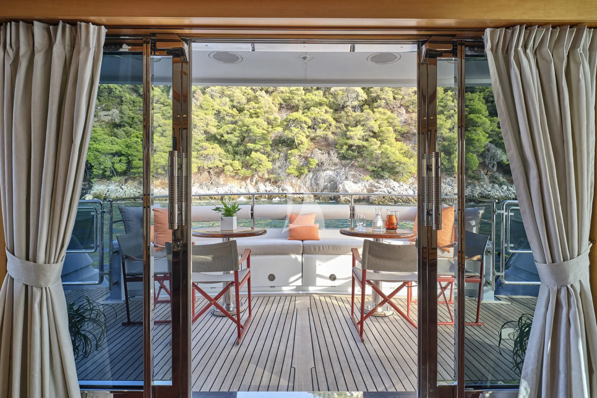a room with a table and chairs aboard ELENA V Yacht for Sale