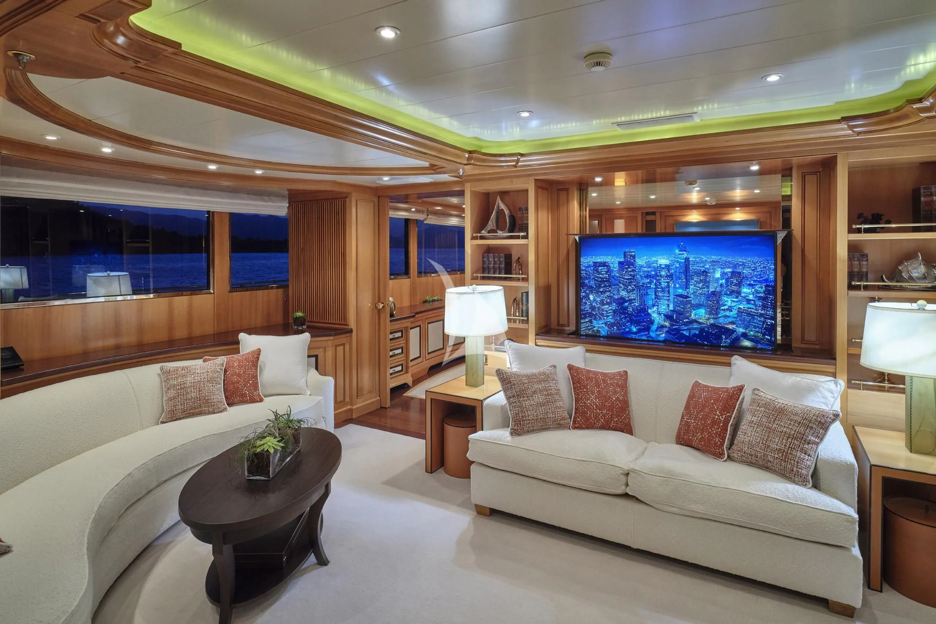 a living room with a large screen aboard ELENA V Yacht for Sale