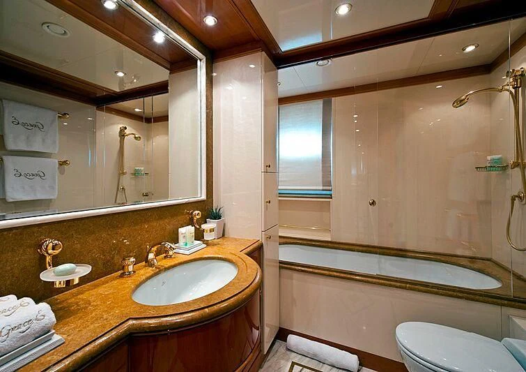 a bathroom with a large mirror aboard ELENA V Yacht for Sale