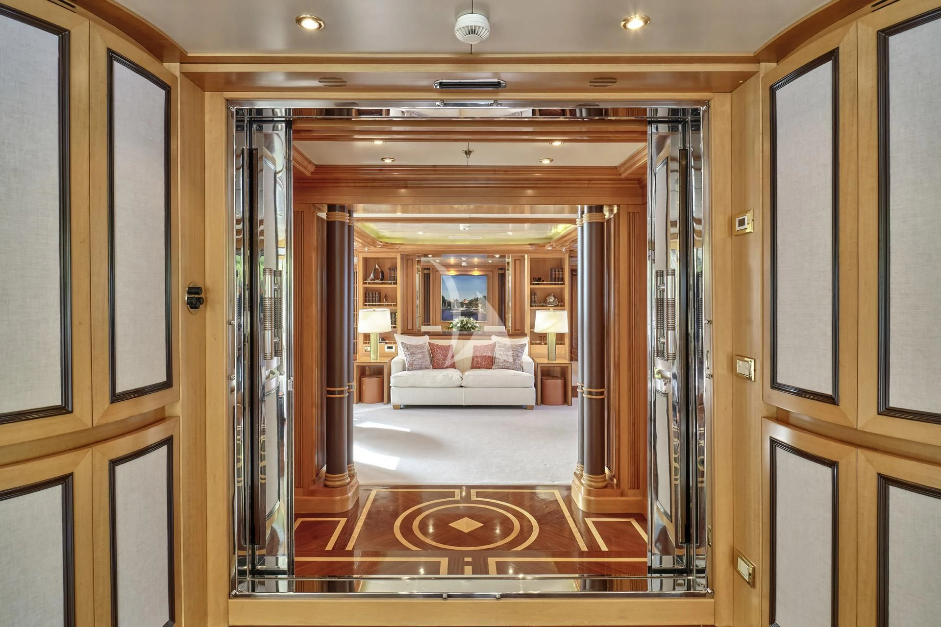 a room with a bed and a mirror aboard ELENA V Yacht for Sale