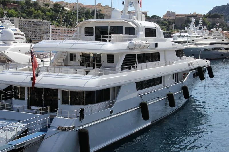 a large white boat in a harbor aboard ELENA V Yacht for Sale