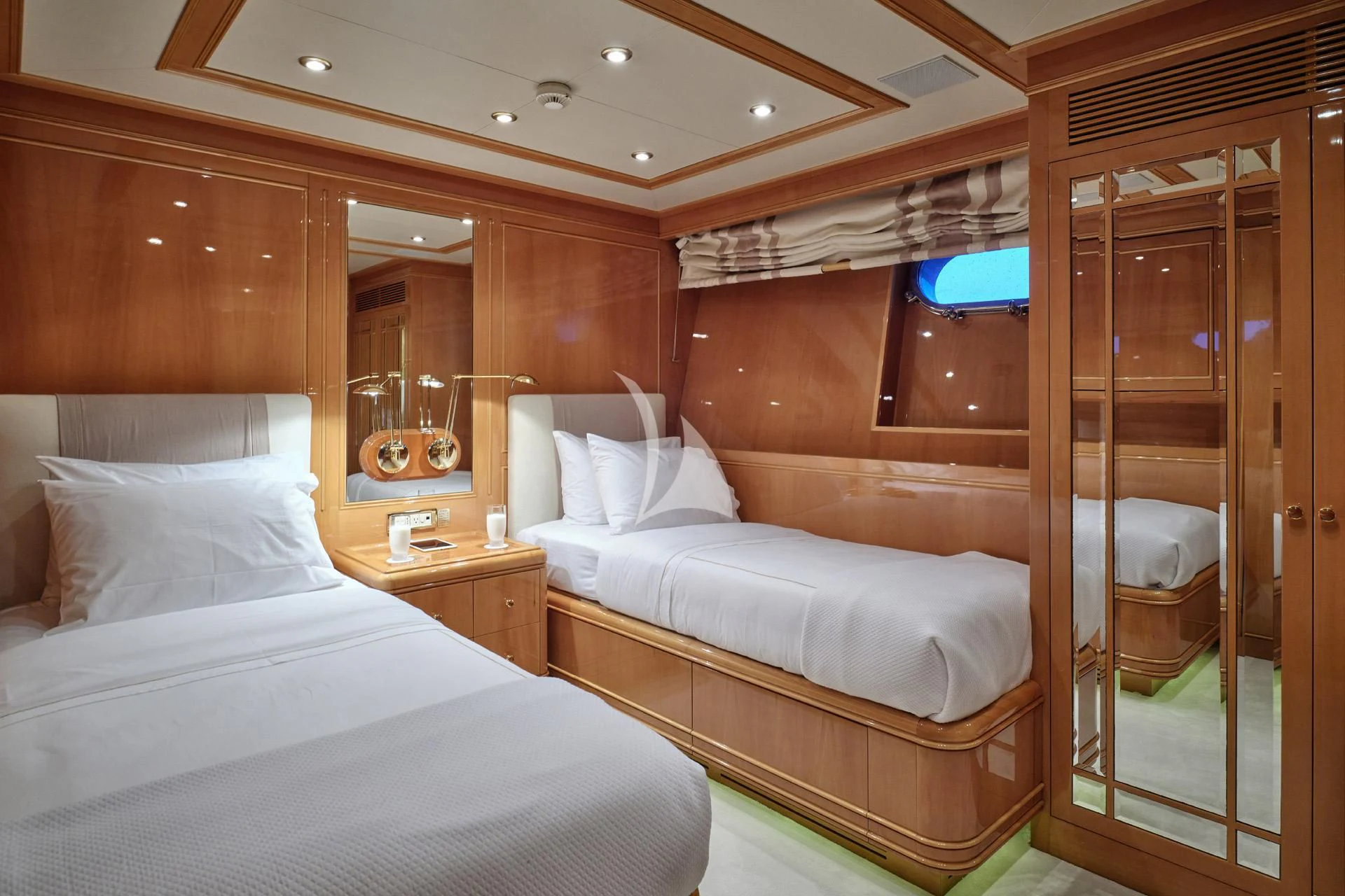 a room with a bed and a mirror aboard ELENA V Yacht for Sale