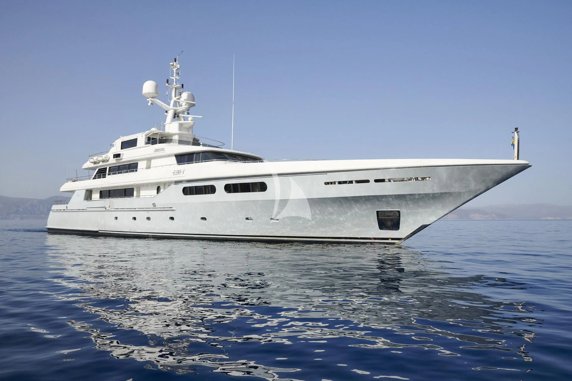 a white ship in the water aboard ELENA V Yacht for Sale
