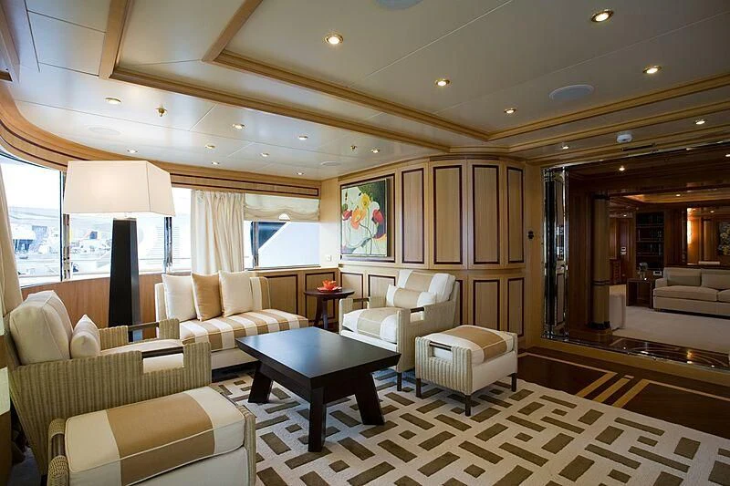 a living room with a table and chairs aboard ELENA V Yacht for Sale