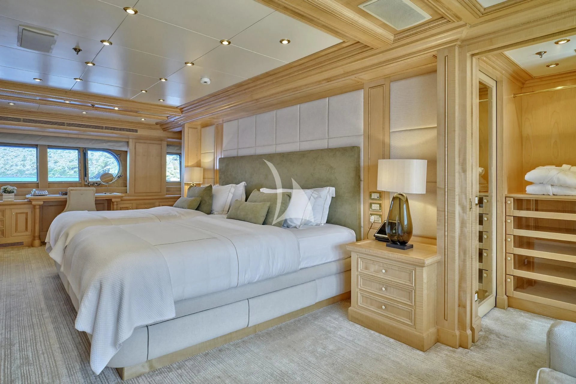 a bedroom with a bed and a desk aboard ELENA V Yacht for Sale