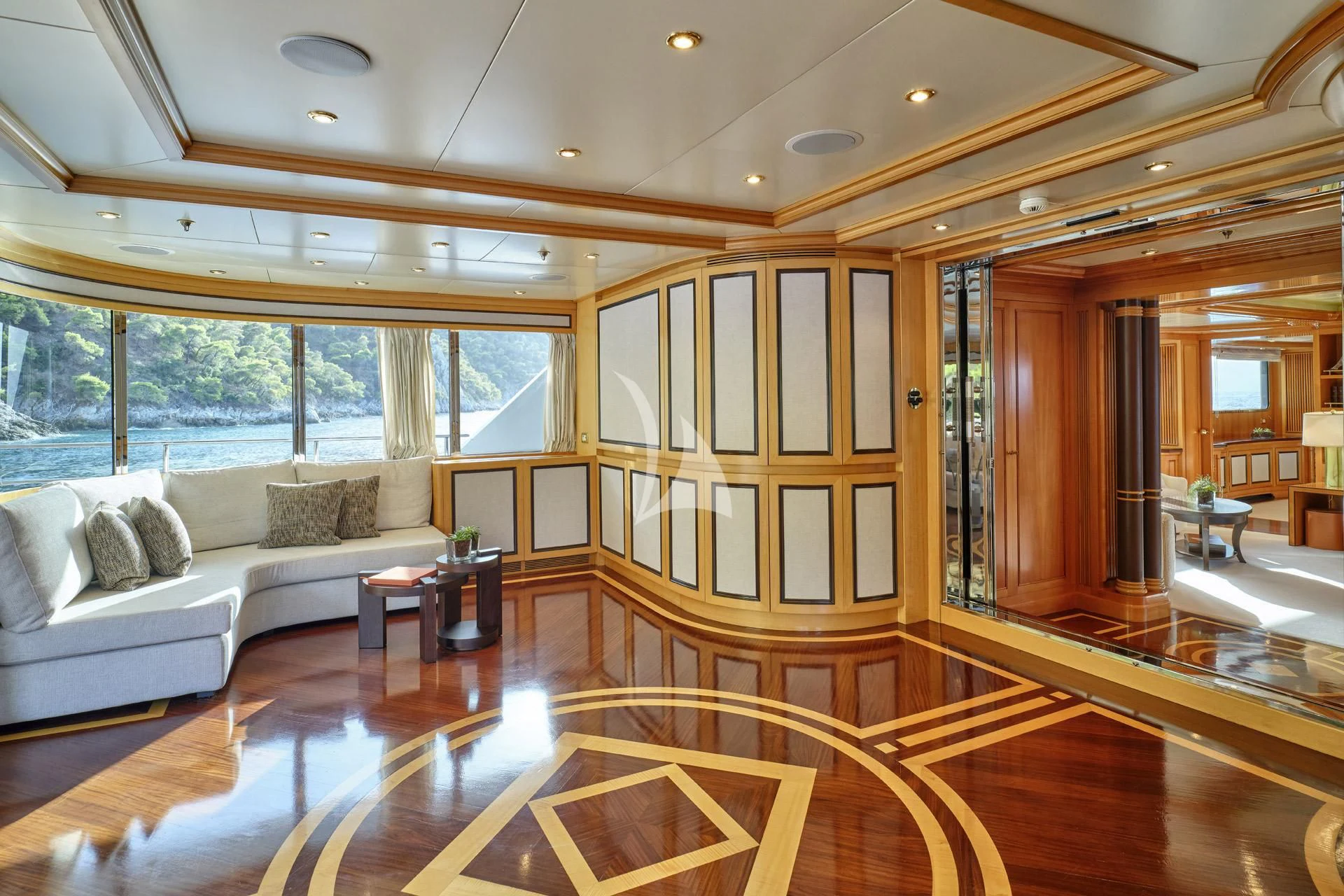 a living room with a large glass door aboard ELENA V Yacht for Sale