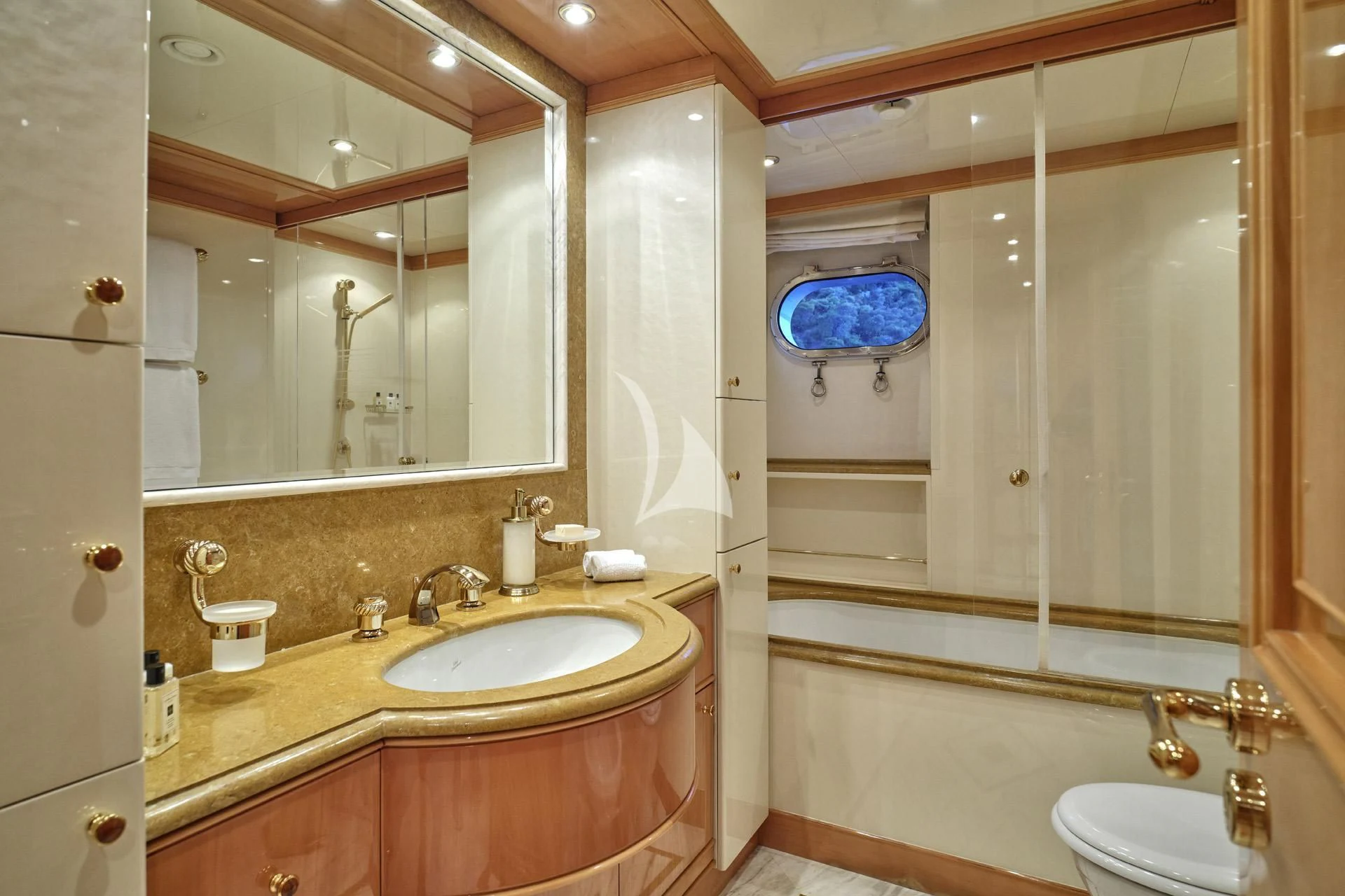 a bathroom with a large mirror aboard ELENA V Yacht for Sale