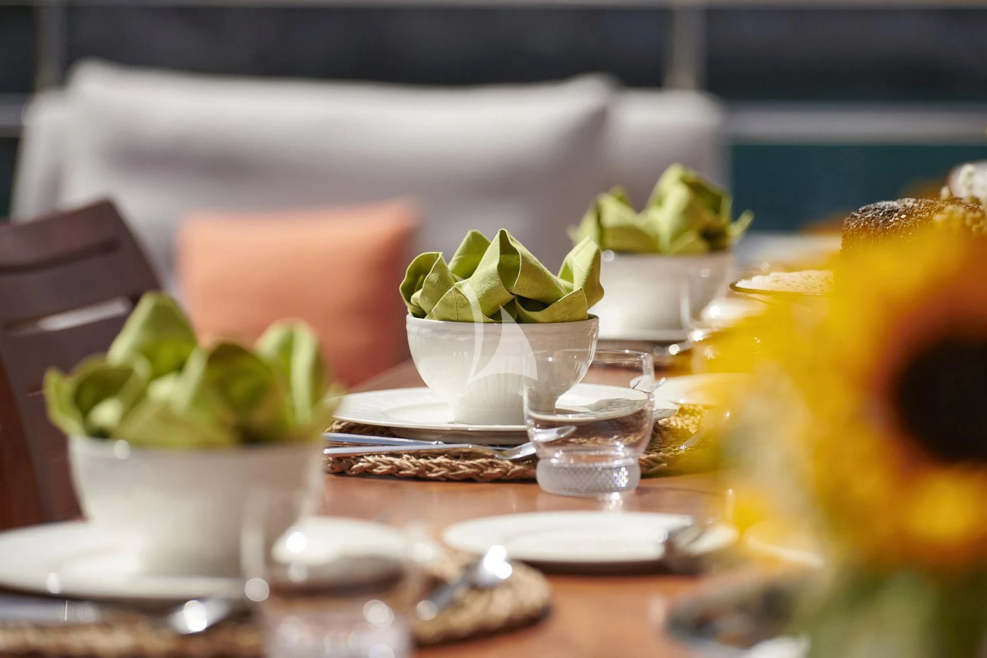 a table with a plate of food and glasses on it aboard ELENA V Yacht for Sale