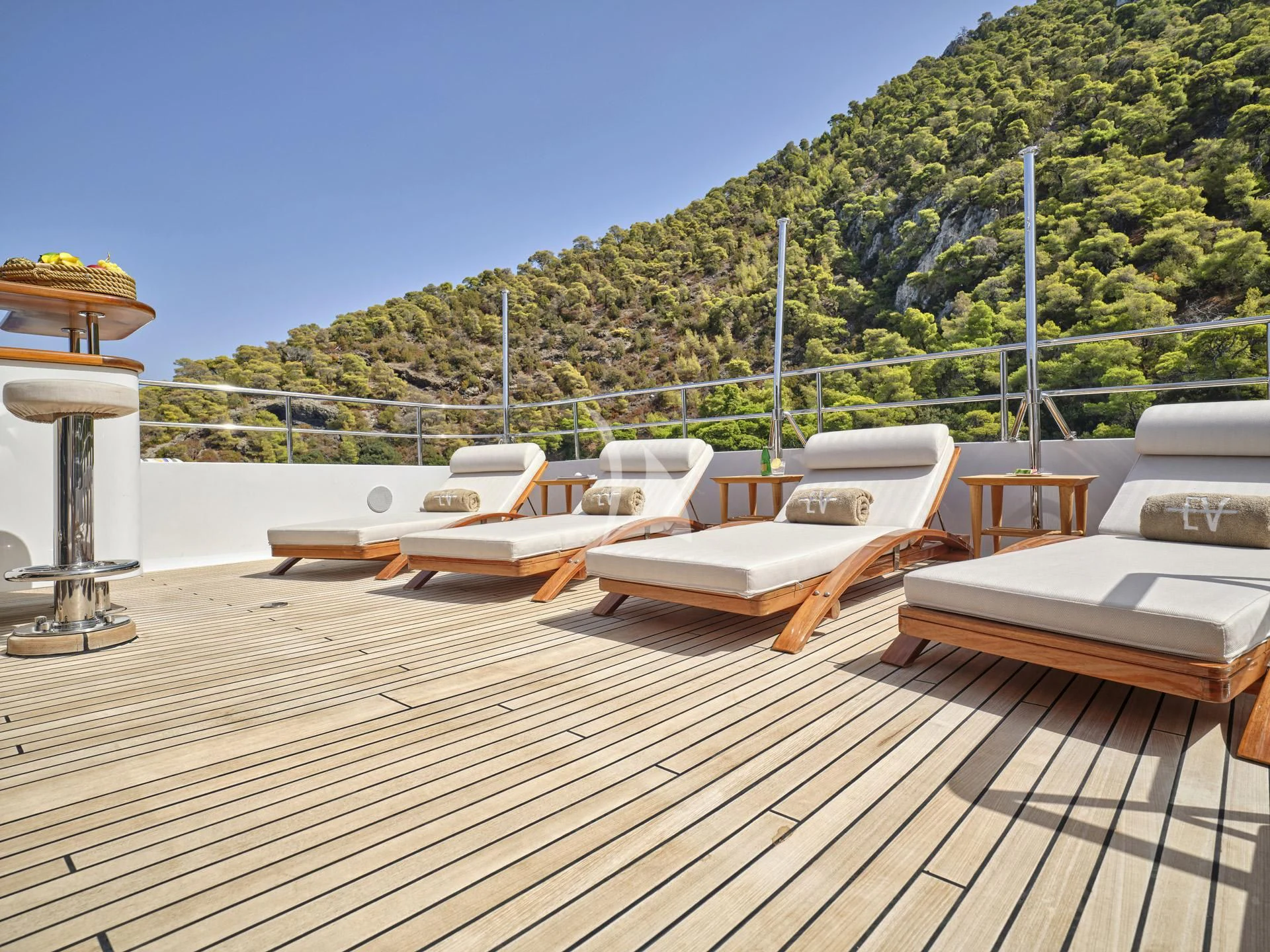 a deck with chairs and tables on it aboard ELENA V Yacht for Sale
