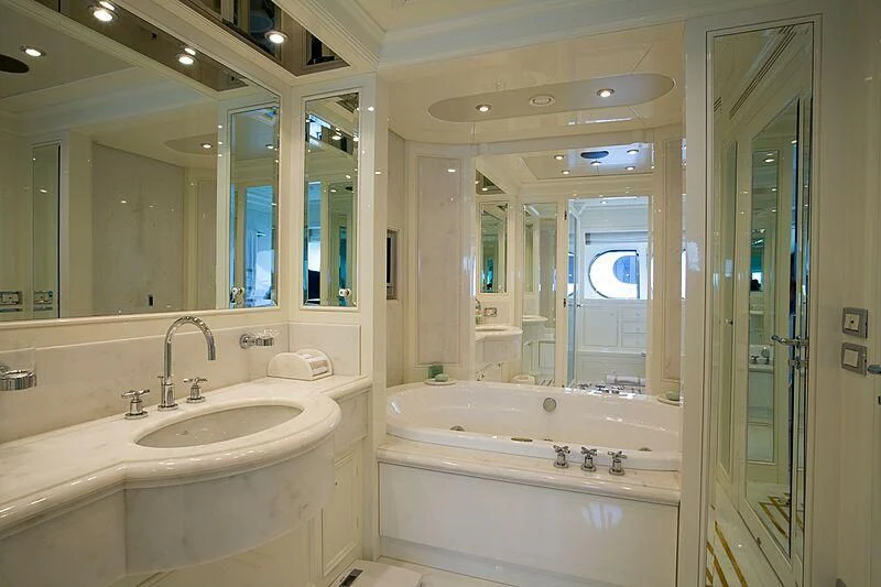 a bathroom with a large mirror aboard ELENA V Yacht for Sale