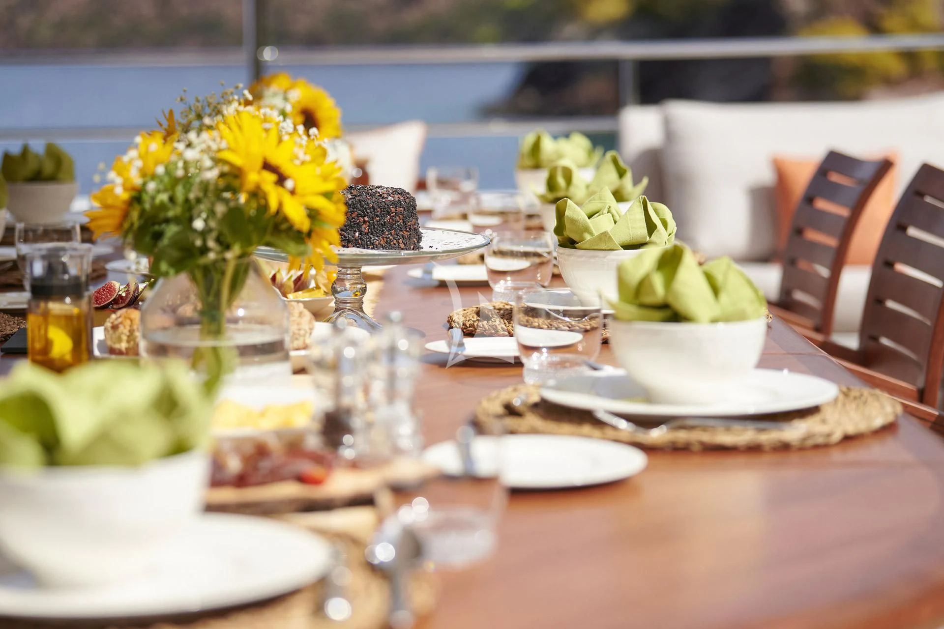 a table with plates and glasses aboard ELENA V Yacht for Sale