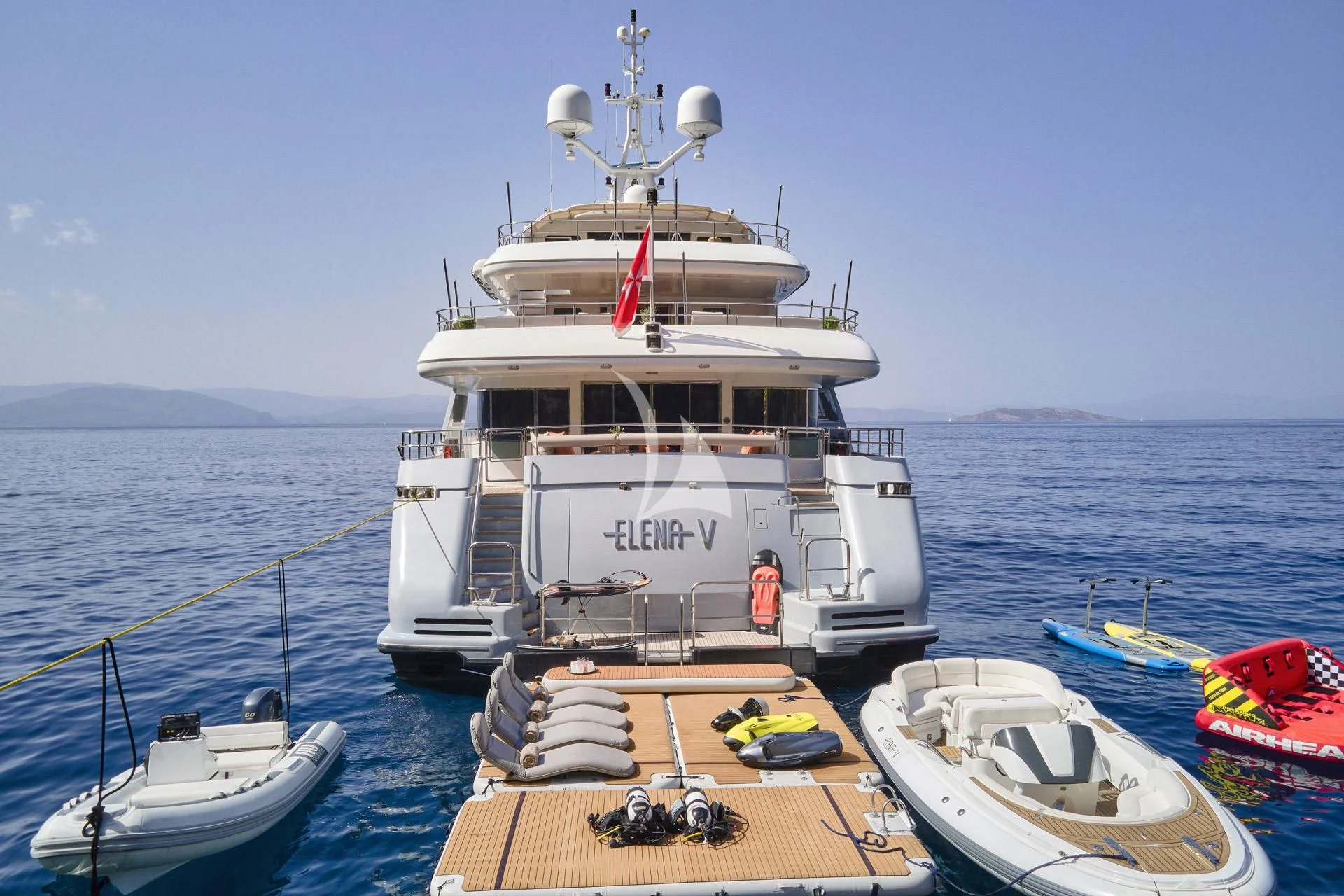 a boat docked at a pier aboard ELENA V Yacht for Sale