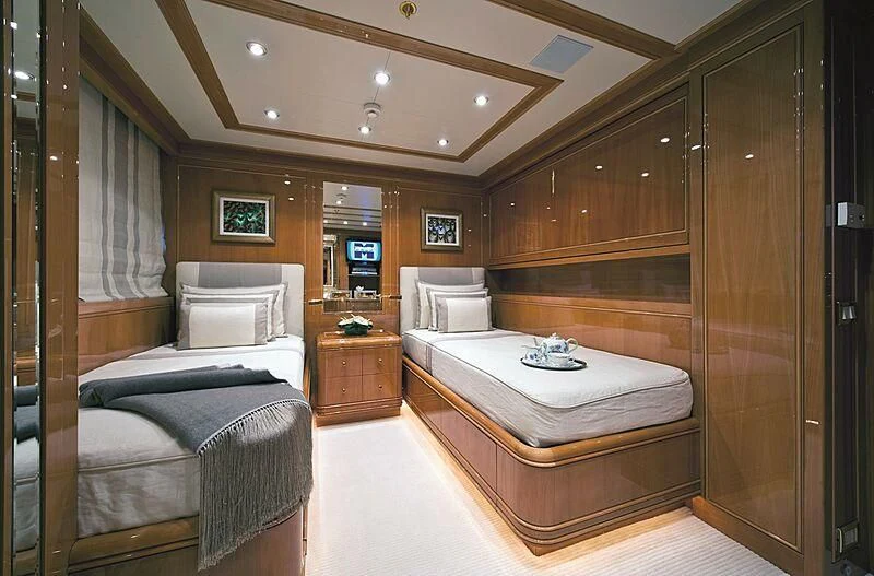 a room with a bed and a desk aboard ELENA V Yacht for Sale