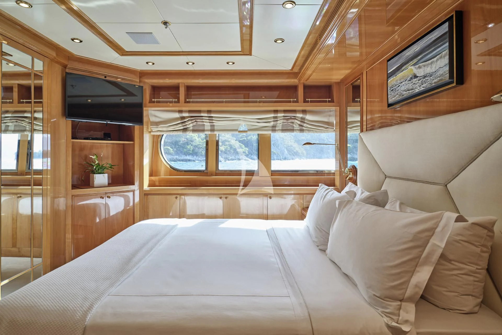 a bed with a white sheet aboard ELENA V Yacht for Sale
