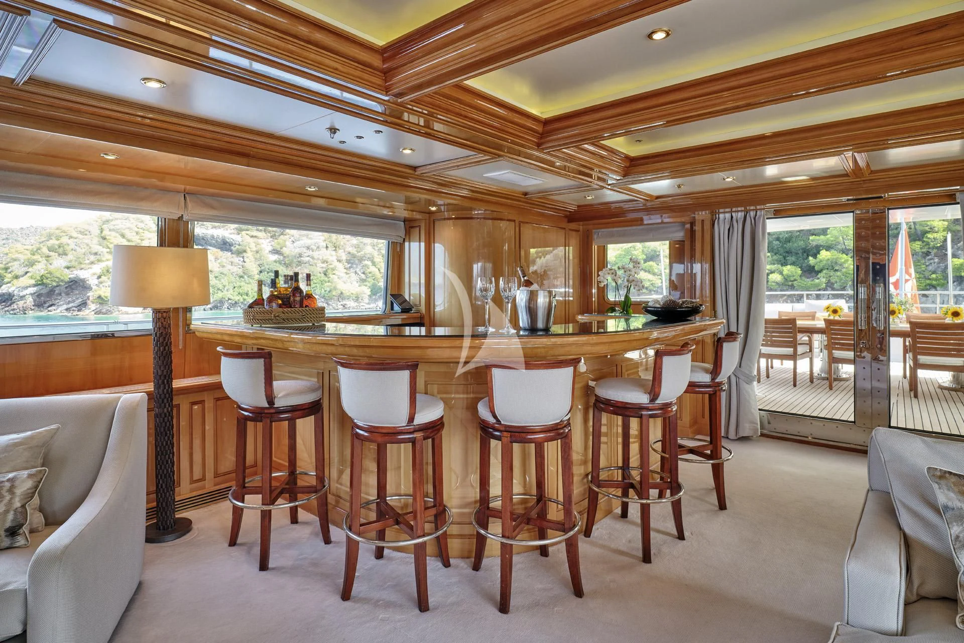 a large kitchen with a table and chairs aboard ELENA V Yacht for Sale