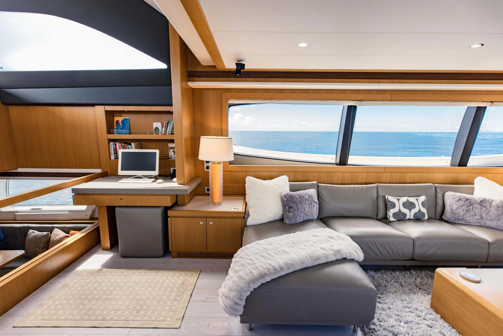 a living room with a large window aboard SHE RUNS WET Yacht for Sale