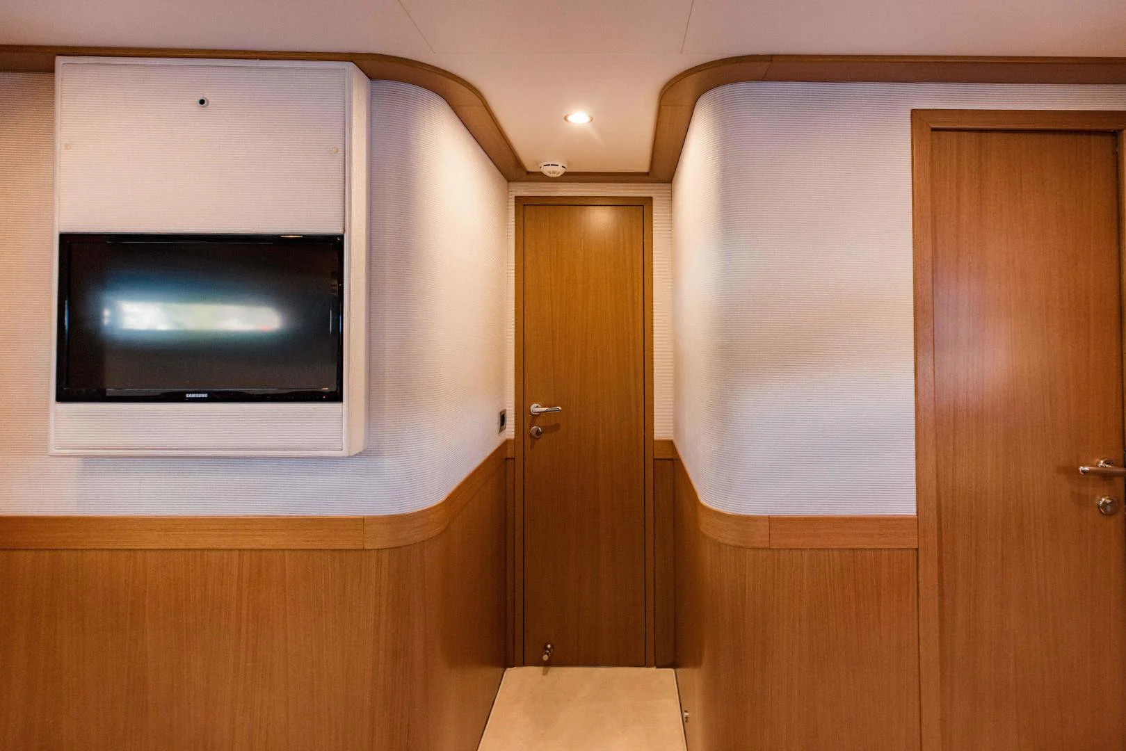 a tv on a wall aboard SHE RUNS WET Yacht for Sale