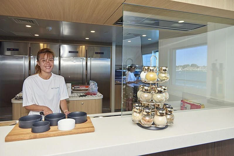 a person in a kitchen aboard CHARLEY Yacht for Sale